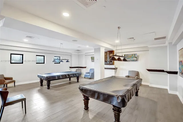 a swimming pool with outdoor seating and yard