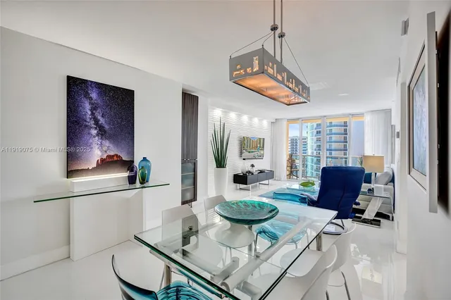 a living room with furniture large window and a large window