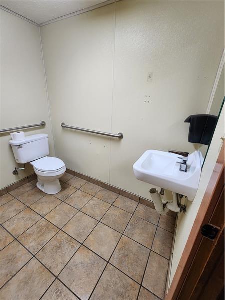 19 East Washington Street, Unit 1 New Castle, PA 16101 - Photo 14 of 16 a bathroom with a sink and a toilet
