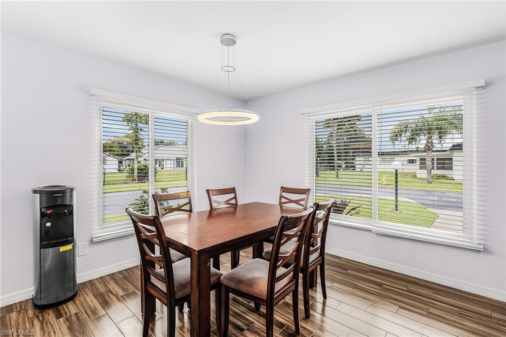 34 Hamlin Court Lehigh Acres, FL 33936 - Photo 12 of 29 a view of a dining room with furniture window and outside view