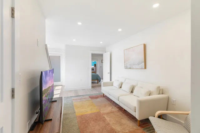 a living room with furniture and a table