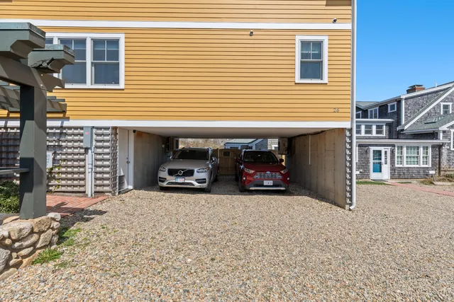 a pathway of a house with a porch