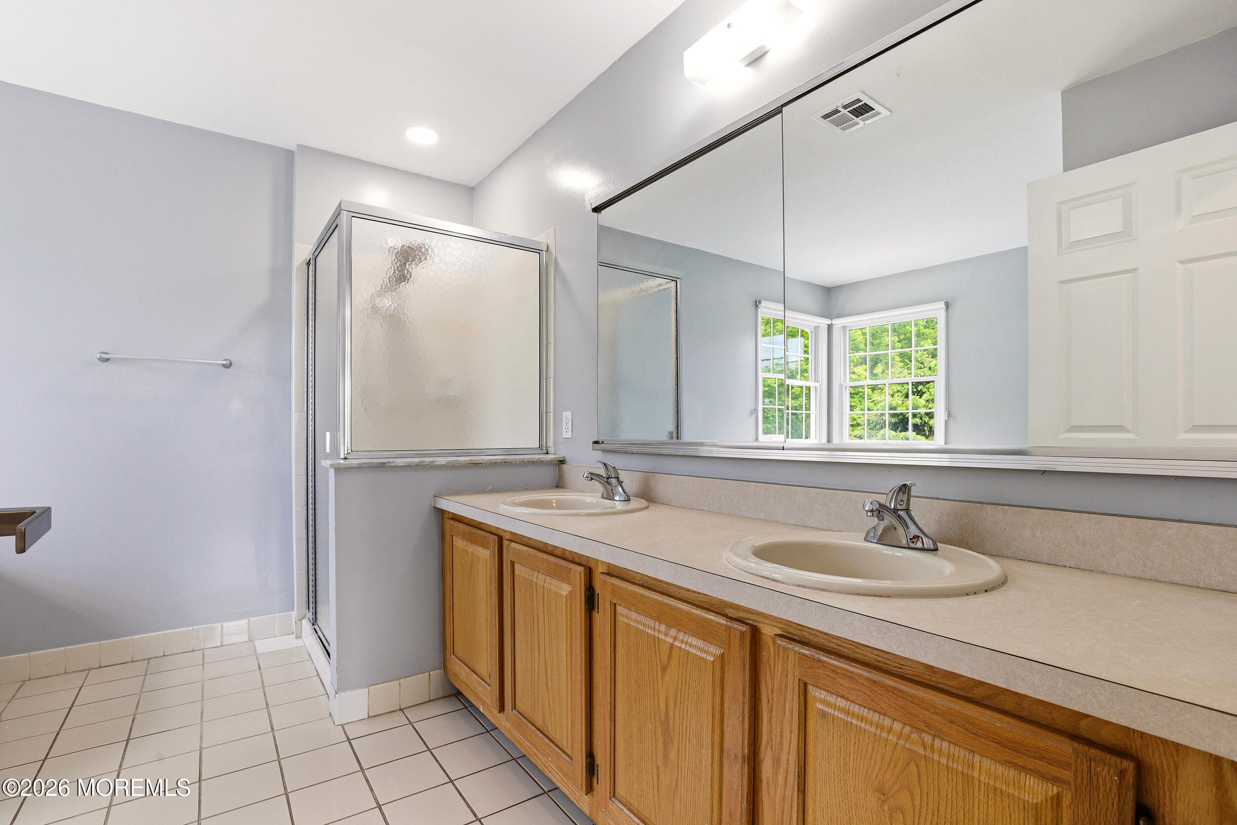 2055 MacKenzie Road Toms River, NJ 08755 - Photo 25 of 56 a bathroom with a sink and a mirror