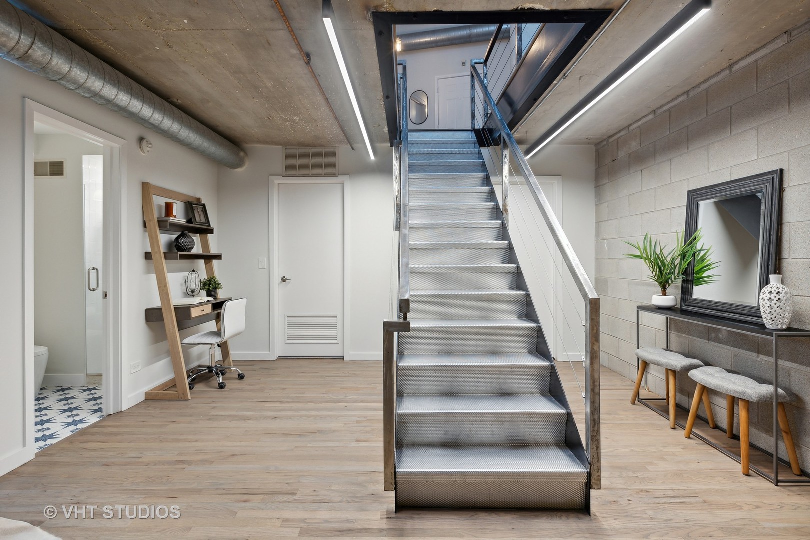 17 North Loomis Street, Unit 1J Chicago, IL 60607 - Photo 19 of 30 a view of staircase with wooden floor and a rug