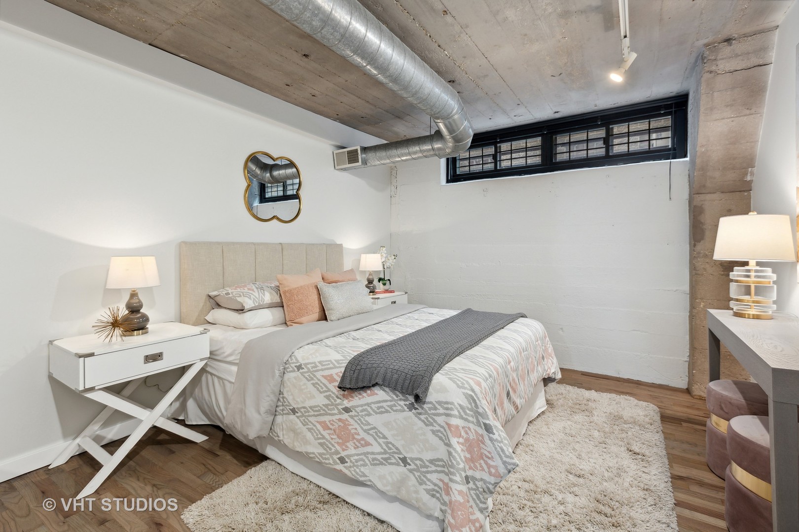 17 North Loomis Street, Unit 1J Chicago, IL 60607 - Photo 22 of 30 a bedroom with a bed and a table in it