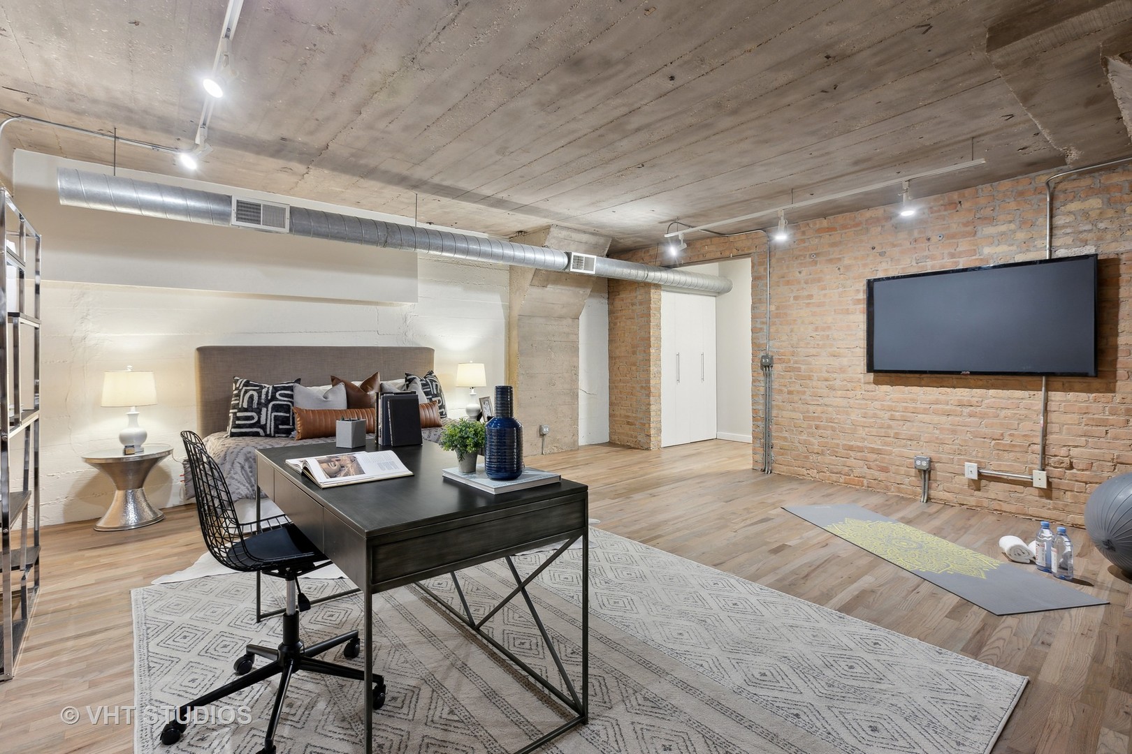 17 North Loomis Street, Unit 1J Chicago, IL 60607 - Photo 25 of 30 a living room with furniture and a flat screen tv