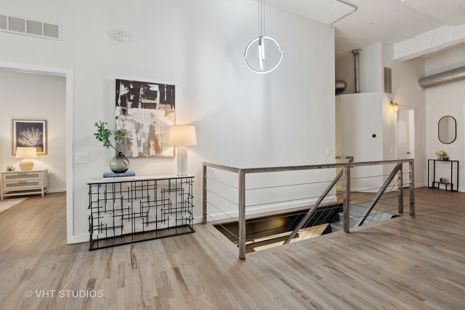 17 North Loomis Street, Unit 1J Chicago, IL 60607 - Photo 10 of 30 a view of livingroom with furniture and wooden floor