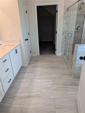 a bathroom with a shower and bathtub