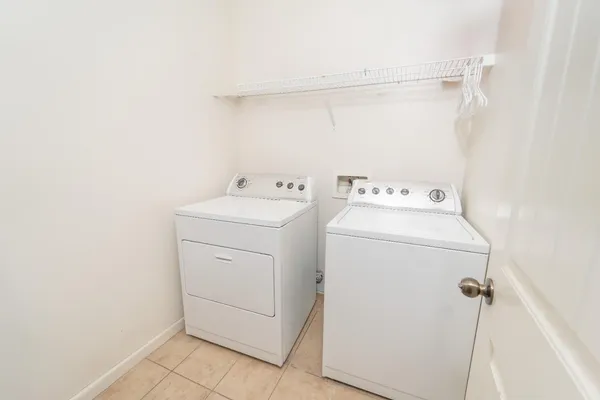 a utility room with dryer and washer