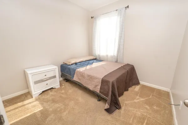a bedroom with a bed and a cabinets