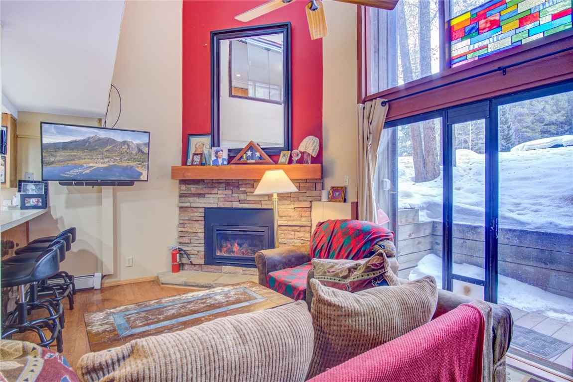 78 Guller Road, Unit 104 Copper Mountain, CO 80443 - Photo 3 of 15 a bedroom with furniture and a fireplace