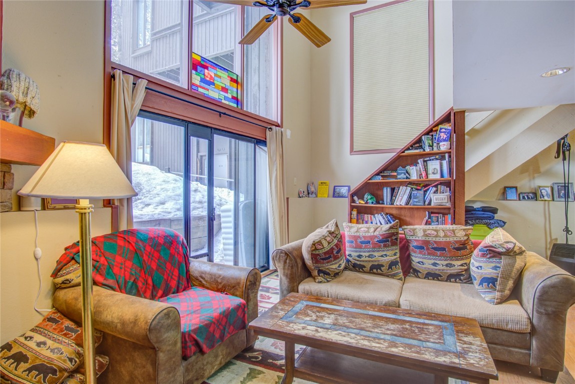 78 Guller Road, Unit 104 Copper Mountain, CO 80443 - Photo 5 of 15 a bedroom with furniture and a chandelier