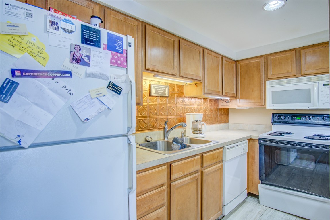 78 Guller Road, Unit 104 Copper Mountain, CO 80443 - Photo 7 of 15 a kitchen with a sink stove top oven and cabinets
