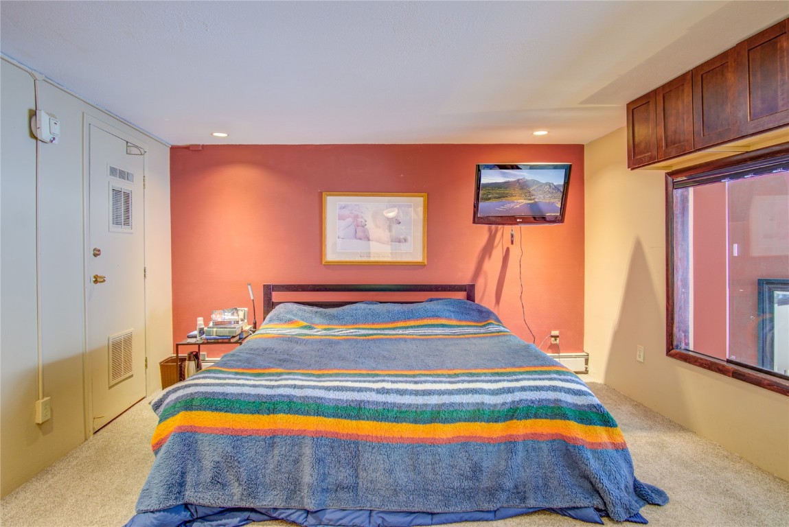 78 Guller Road, Unit 104 Copper Mountain, CO 80443 - Photo 9 of 15 a bedroom with a bed and a window