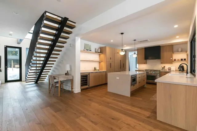 a view of kitchen with furniture and wooden floor