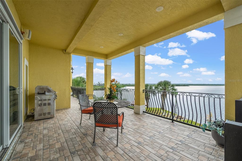 3236 Gulf Winds Circle Hernando Beach, FL 34607 - Photo 21 of 96 a balcony with furniture and city view