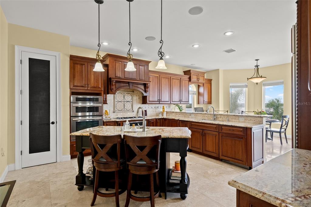 3236 Gulf Winds Circle Hernando Beach, FL 34607 - Photo 22 of 96 a large kitchen with a table and chairs