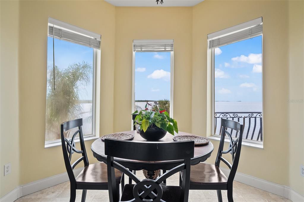 3236 Gulf Winds Circle Hernando Beach, FL 34607 - Photo 28 of 96 a view of a dining room with furniture and window