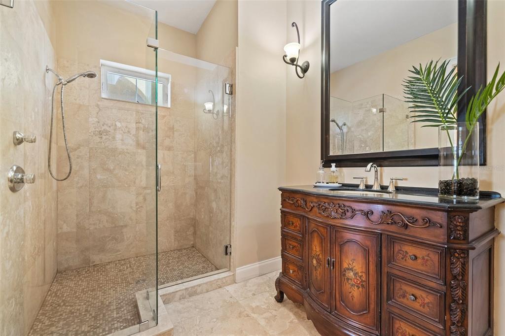 3236 Gulf Winds Circle Hernando Beach, FL 34607 - Photo 29 of 96 a bathroom with a shower sink and mirror