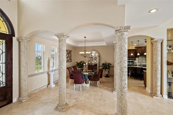 a spacious bathroom with a shower a sink and a large mirror