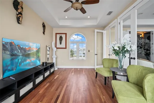 a living room with furniture and large window