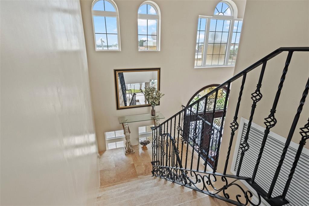 3236 Gulf Winds Circle Hernando Beach, FL 34607 - Photo 46 of 96 a view of staircase with lots of frames on wall and a window