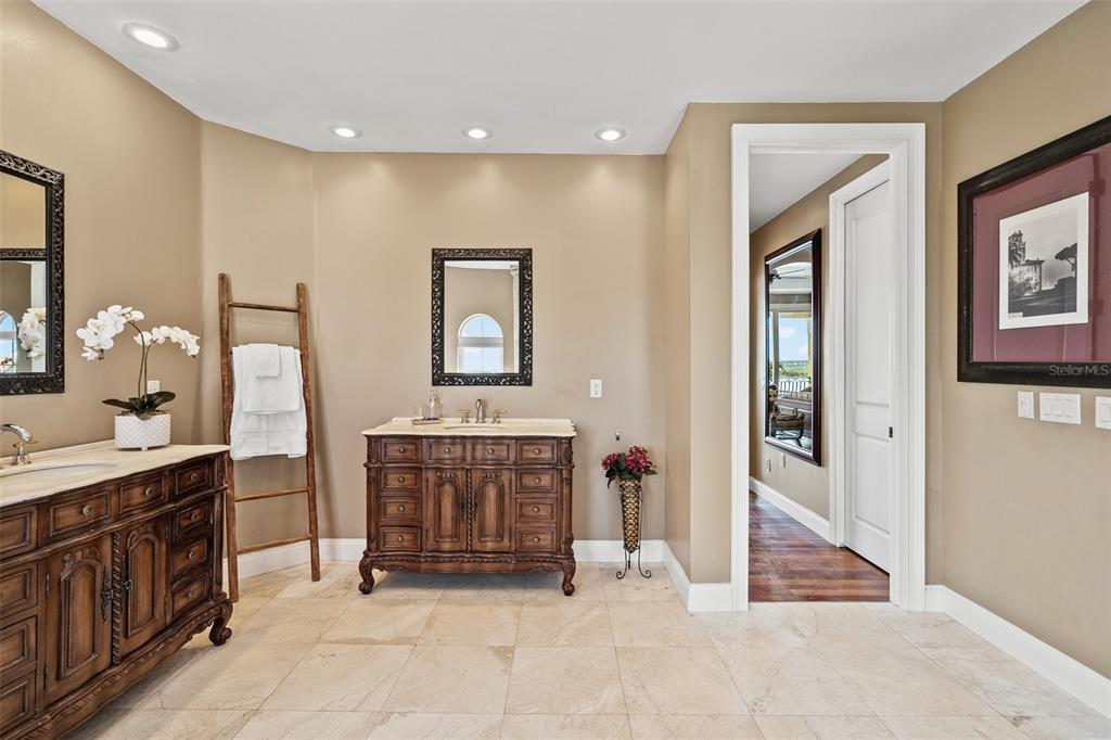 3236 Gulf Winds Circle Hernando Beach, FL 34607 - Photo 61 of 96 a spacious bathroom with a mirror and a sink