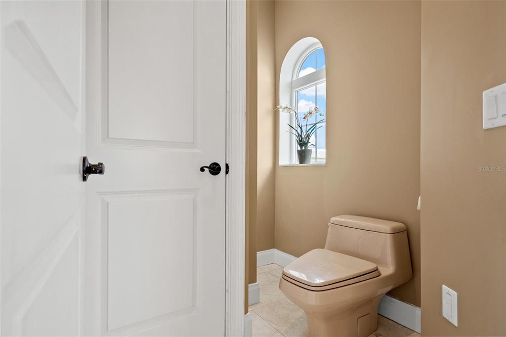 3236 Gulf Winds Circle Hernando Beach, FL 34607 - Photo 62 of 96 a white toilet sitting next to a bathroom sink