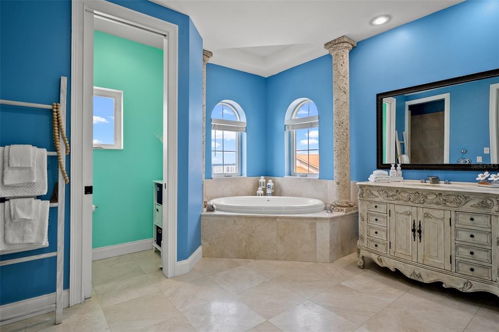 3236 Gulf Winds Circle Hernando Beach, FL 34607 - Photo 69 of 96 a spacious bathroom with a double vanity sink a mirror and a bathtub