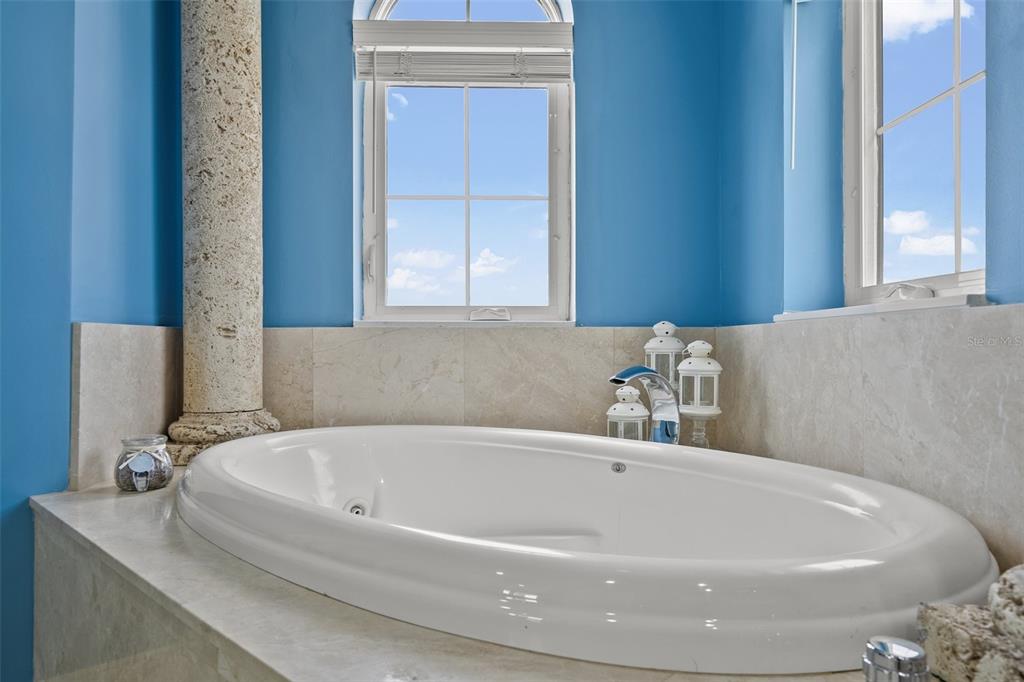 3236 Gulf Winds Circle Hernando Beach, FL 34607 - Photo 71 of 96 a white bath tub sitting in a bathroom