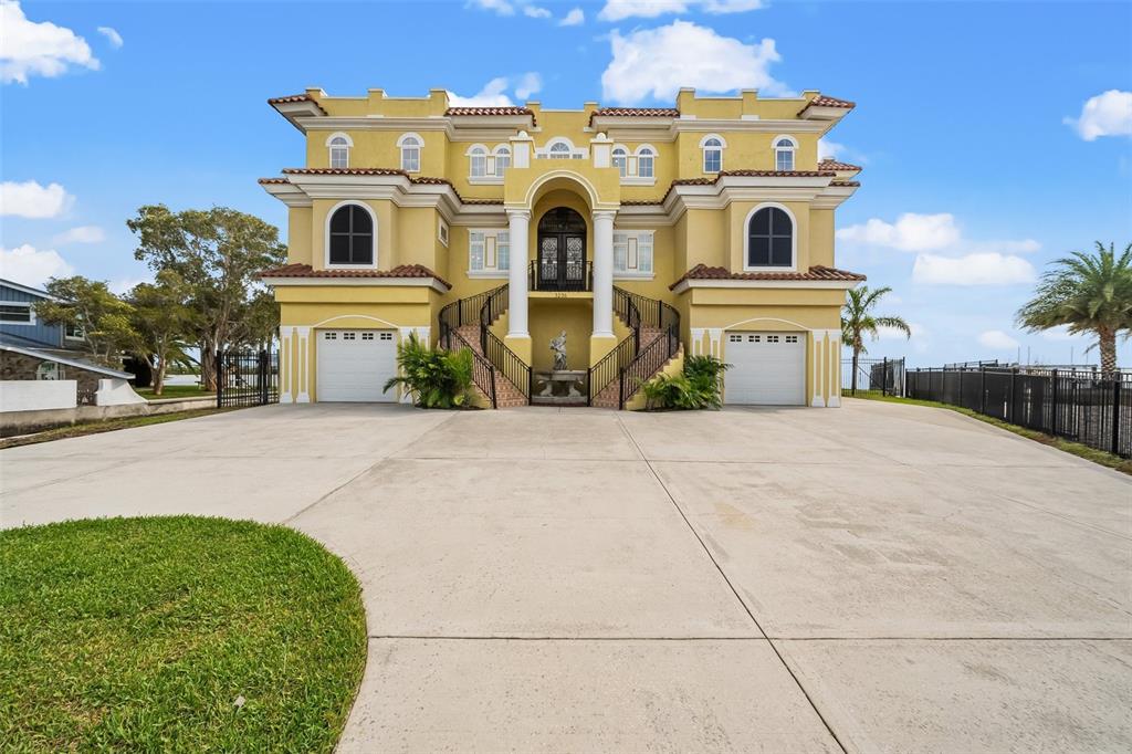 3236 Gulf Winds Circle Hernando Beach, FL 34607 - Photo 89 of 96 a front view of a house with a yard