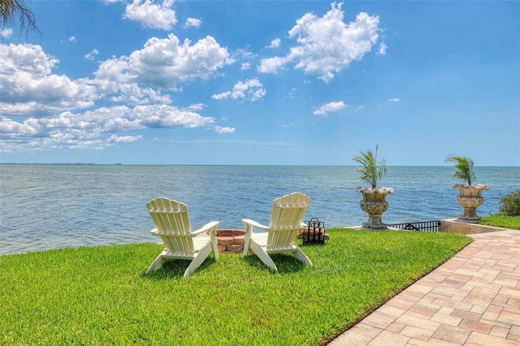 3236 Gulf Winds Circle Hernando Beach, FL 34607 - Photo 96 of 96 a park view with a bench and garden