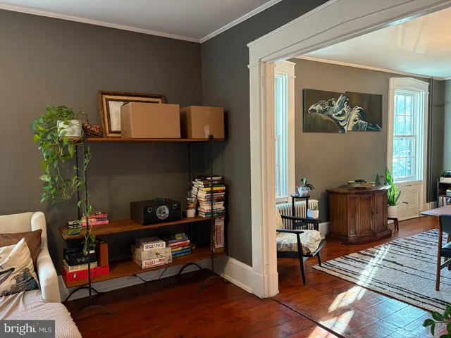 a room with furniture and a wooden floor