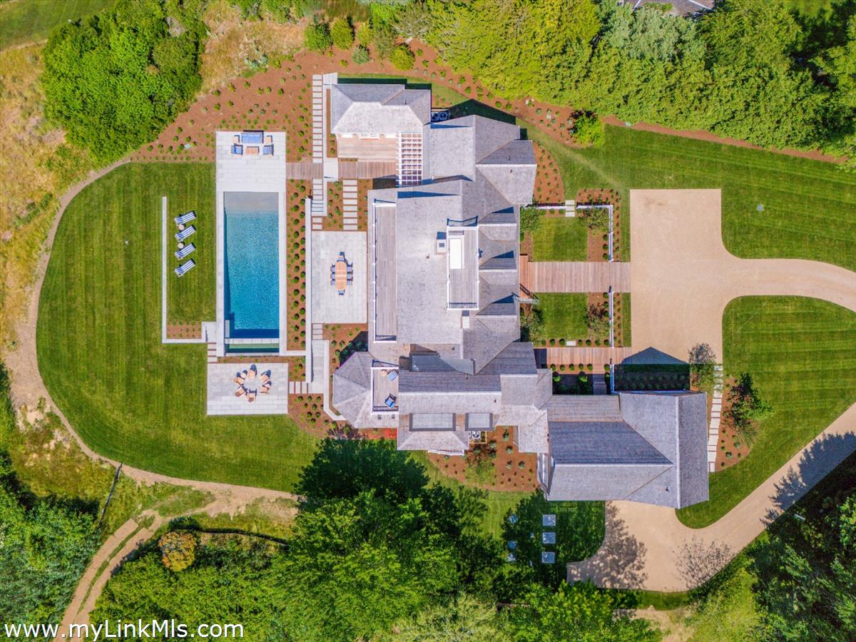 256 Polpis Road Nantucket, MA 02554 - Photo 2 of 30 an aerial view of a house with outdoor space pool seating area and yard