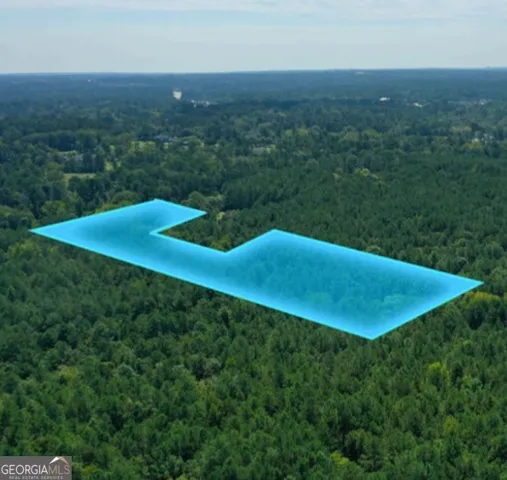 a view of a swimming pool with a yard