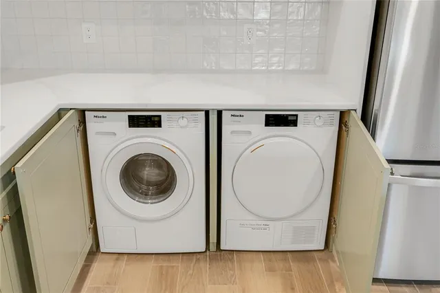 a utility room with dryer and washer