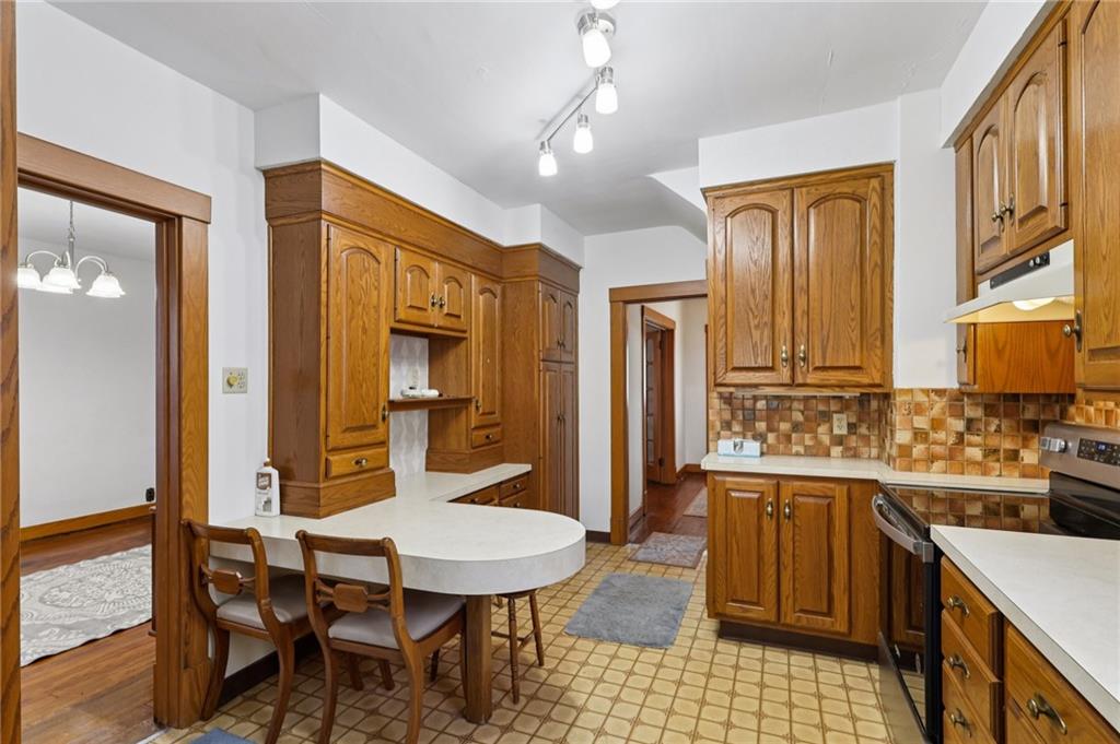 1910 Ridge Avenue New Kensington, PA 15068 - Photo 16 of 50 a kitchen with a sink a counter space and dining table