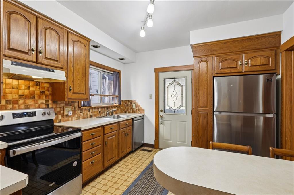 1910 Ridge Avenue New Kensington, PA 15068 - Photo 18 of 50 a kitchen with stainless steel appliances a refrigerator a stove a sink and dishwasher