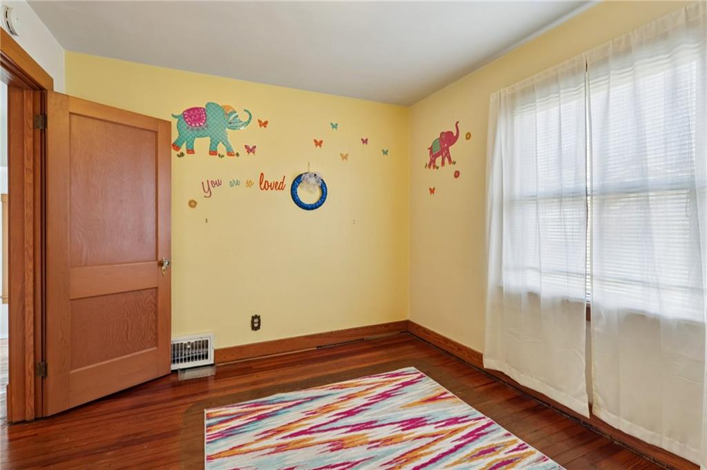 1910 Ridge Avenue New Kensington, PA 15068 - Photo 30 of 50 a room with a bed and wooden floor