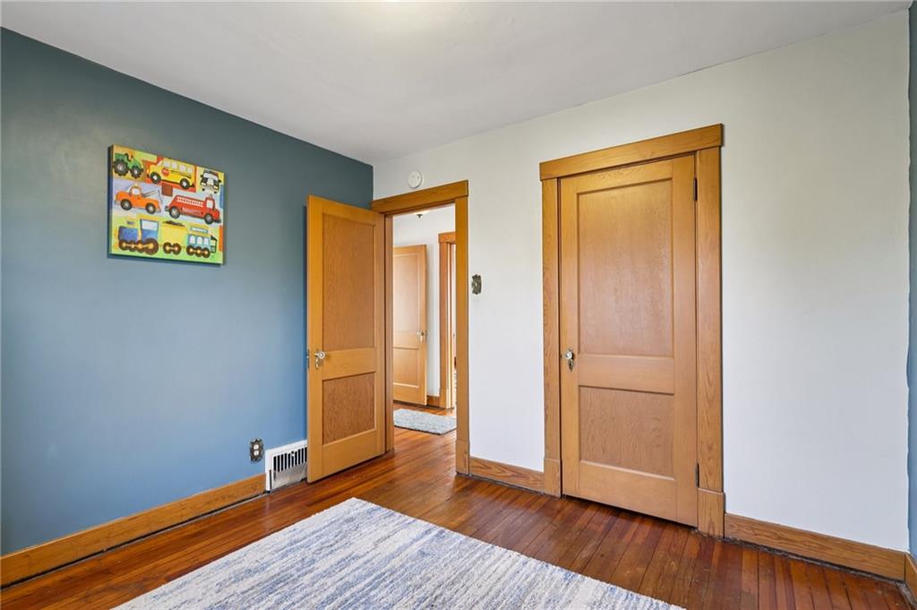 1910 Ridge Avenue New Kensington, PA 15068 - Photo 33 of 50 an empty room with wooden floor and door