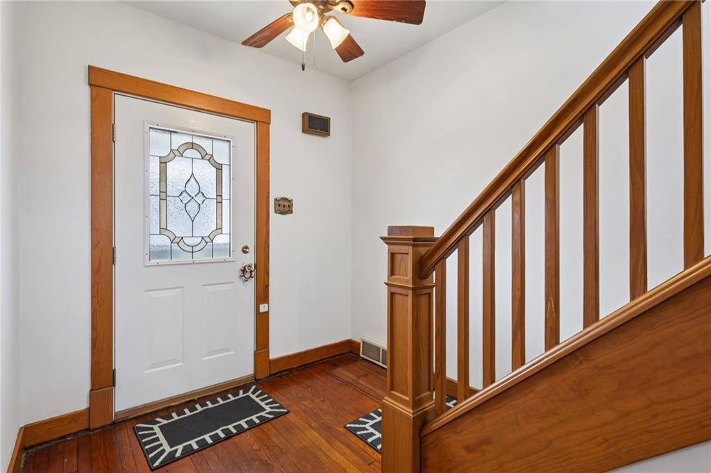 1910 Ridge Avenue New Kensington, PA 15068 - Photo 7 of 50 a view of a hallway with wooden floor and staircase
