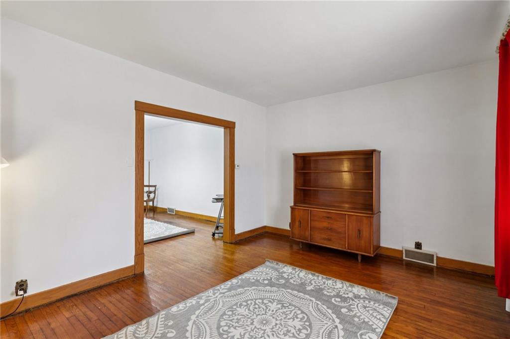 1910 Ridge Avenue New Kensington, PA 15068 - Photo 9 of 50 an empty room with a dresser and mirror