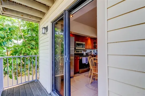 a bathroom with a granite countertop sink a mirror and vanity