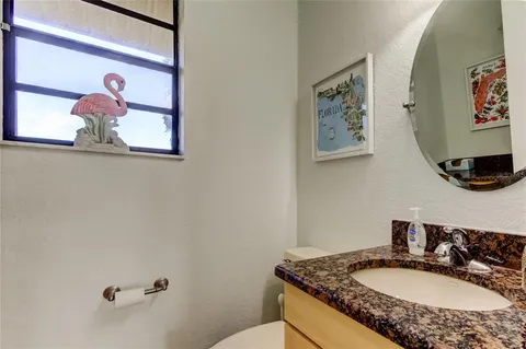 a view of a hallway with wooden floor and entryway
