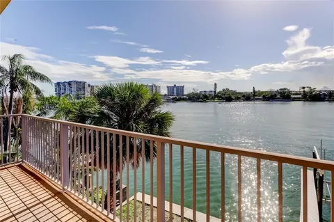 a bathroom with a granite countertop shower a mirror and a sink