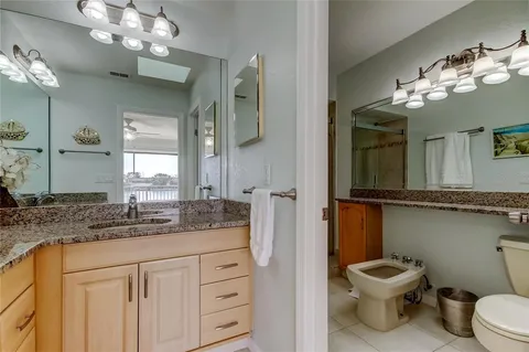 a bathroom with a sink vanity and a mirror