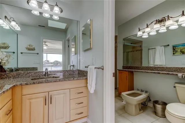 a bathroom with a sink vanity and a mirror