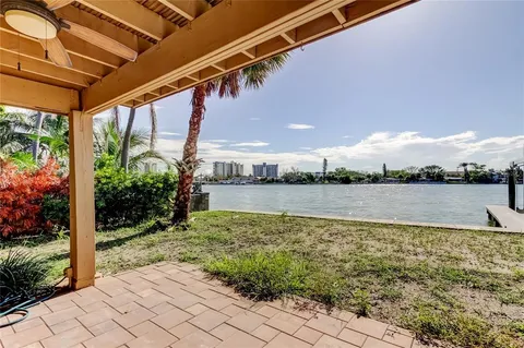 a kitchen with white cabinets a sink and appliances