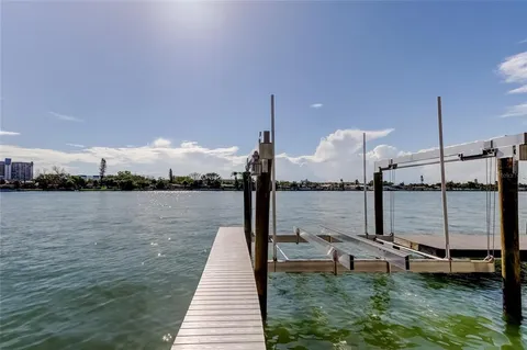 a view of a lake with outdoor seating