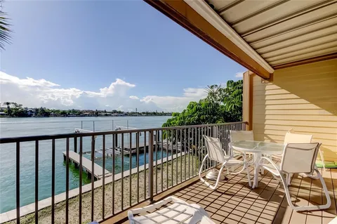 a view of balcony with furniture